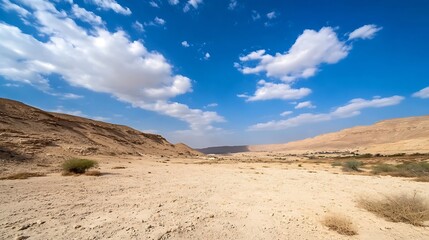Breathtaking desert landscape with golden hills and dramatic clouds under a bright blue sky : Generative AI
