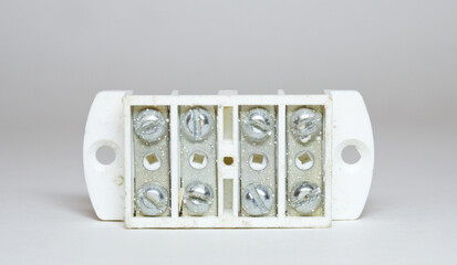 modular terminal block, electric wires connecting panel with mounting holes on white plastic insulated frame with barriers. four gang. double row. with screw mount