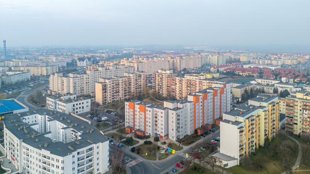 city ​​landscape in poland in the morning. aerial view of sunrise in the city of Kalisz. illuminated apartment blocks, skyscrapers and streets.