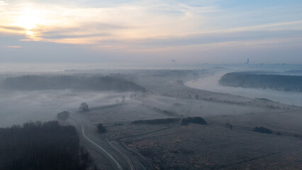 beautiful spring sunrise over the Odra River in front of Wrocław. spring fog. aerial view of meadows fields in fog © Adam