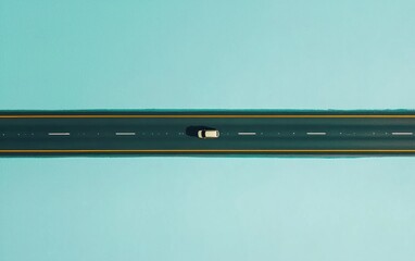 Aerial view of a lone car driving on a long road, with a light teal background. The image is minimalistic and features a high angle perspective