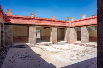 Intricate courtyard of an ancient palace in Teotihuacán, Mexico, showcasing carved stone columns...