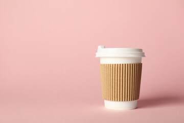 Paper cup on pink background. Mockup for design
