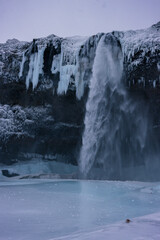 Beautiful Seljalandsfoss waterfall and surrounding area in winter (South Iceland)