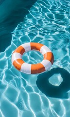 Bright orange lifebuoy floating in pristine blue pool water with sunlit ripples