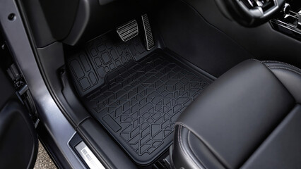 Luxury Car Interior Features Black Leather Seat and Rubber Floor Mat