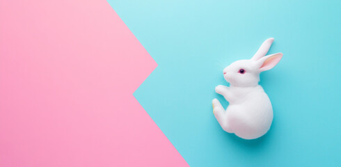 White rabbit on a pastel blue and pink background with copy space, banner design.