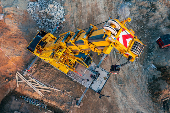 A yellow truck crane LIEBHERR of Hany&scaron; &ndash; Crane Services, a company that focuses its business on heavy transport units, providing crane and transport services.