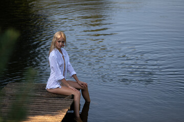 Portrait of a young beautiful blonde girl in nature.