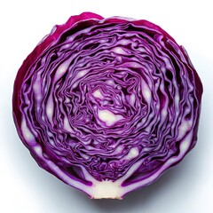 Obraz premium A red cabbage, cut in half, with the inside of one side showing a pattern of purple and white stripes.
