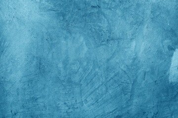 blue background of blue plaster with scuffs and unevenness
