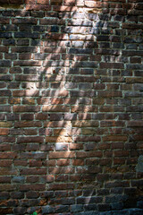 The wall is made of old red brick. Brick background.