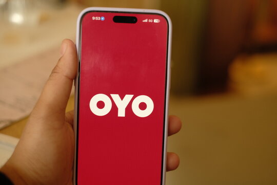 OYO app on Smartphone screen, commonly referred to as OYO, is a hospitality company based in India that operates a chain of budget hotels and accommodations : New Delhi, India 2025