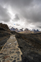 Stone trail leading to Pastoruri Glacier, Huaraz, Peru, amidst rugged mountains
