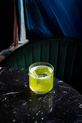 Gin basil smash alcoholic cocktail in a lowball rocks glass