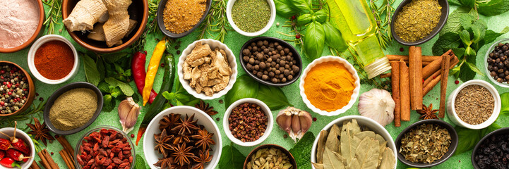 A beautiful collection of colorful spices and herbs, showcasing their natural aromas and vibrant hues on a gentle green background, banner
