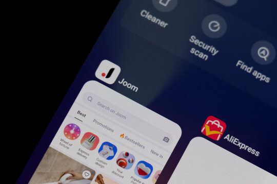 Warsaw, Poland - March 10, 2025: Close-up view of Joom app interface on a smartphone, showcasing shopping options and promotions.