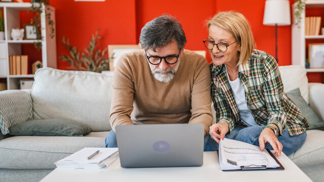 two colleague work from home together planning and research on laptop - Powered by Adobe