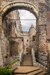 External view of the medieval stone walls of the Castle of the Counts (Gravensteen) in Ghent, Belgium