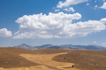 photographs of rural areas, landscapes and arid mountains and hills.