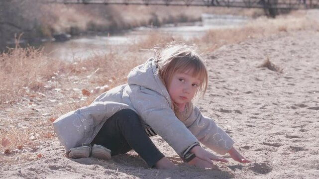 Cute Toddler Playing in the Sand