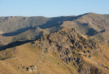 photographs of rural areas, landscapes and arid mountains and hills.