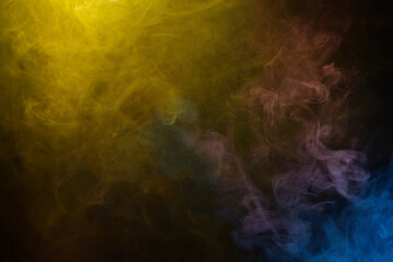 Yellow and pink steam on a black background.
