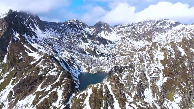 Aerial drone view of Rheinquelle Tomasee, Oberalp Pass, Canton Uri, Switzerland