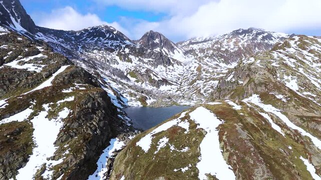 Aerial drone view of Rheinquelle Tomasee, Oberalp Pass, Canton Uri, Switzerland
