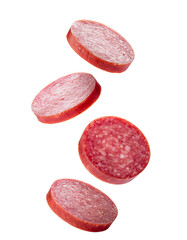 Naklejka premium Slices of salami falling on transparent background