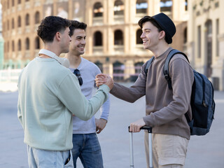 Happy moment: friends meeting again with a handshake