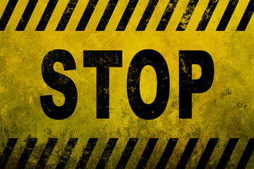 Stop danger sign word text as stencil with yellow and black stripes painted over concrete wall...