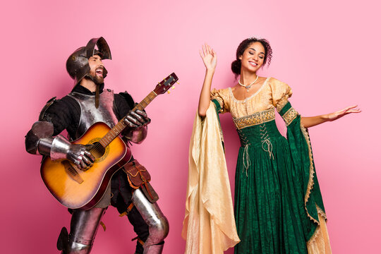 Knight and lady dancing in medieval attire against a pink background for a theme party celebration