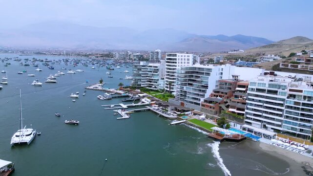 Aerial drone view of Ancon Beach on a bright summer day, capturing the vibrant coastal life.