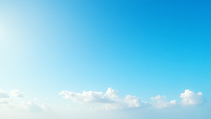 Bright blue sky with fluffy clouds on a clear summer day