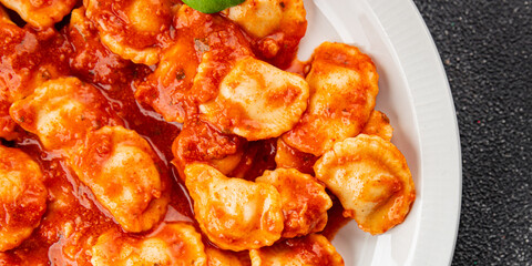 Ravioli tomato sauce delicious gourmet food background on the table rustic food top view copy space