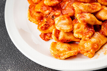 Ravioli tomato sauce delicious gourmet food background on the table rustic food top view copy space