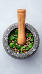 Herbal blend in a stone mortar and pestle