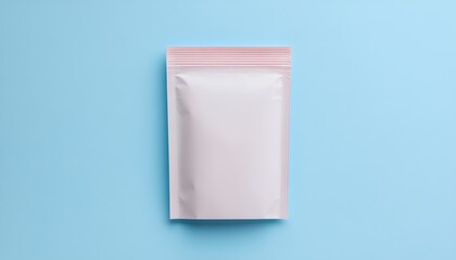 Pink pouch on light blue background. Packaging concept