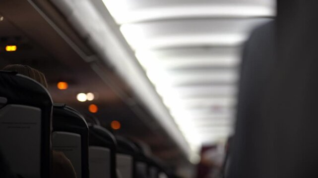 The warning light in the passenger cabin lights up, warning of seat belt fastening. Flight safety rules and procedures. High quality 4k footage