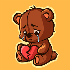 Sad teddy bear crying and holding a broken heart.
