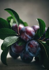 Fresh plums with green leaves, showcasing vibrant colors and natural beauty