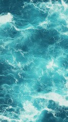 aerial view of a turquoise ocean with gentle waves, mobile phone wallpaper, background
