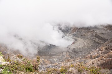 Steaming Poás Volcano Crater with Sulfuric Fumes in Rugged Landscape
