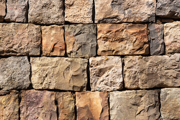 Rustic brick wall with a stone texture. Historic castle facade featuring an aged masonry pattern....
