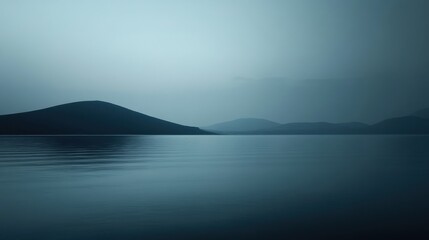 Fototapeta premium Serene Landscape with Calm Water and Gentle Hills at Dusk