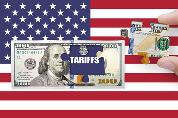 100 US dollar note on a USA flag with word TARIFFS