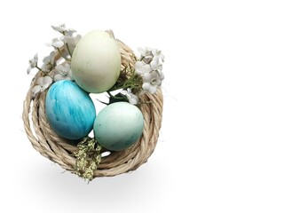 colorful eggs in nest isolated on white background representing easter