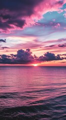 beautiful sunset with pink and purple clouds on the sea, ideal for an mobile phone wallpaper, phone background, or screen