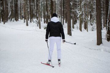 Cross-country skiing.A skier goes skiing in winter on a ski run.